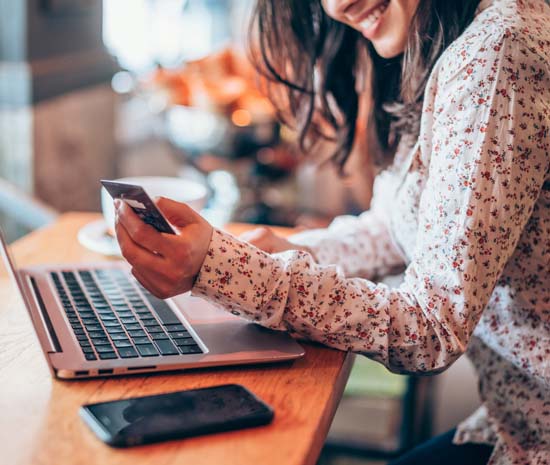 woman using card online for purchase