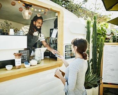 Woman purchasing at a food stall