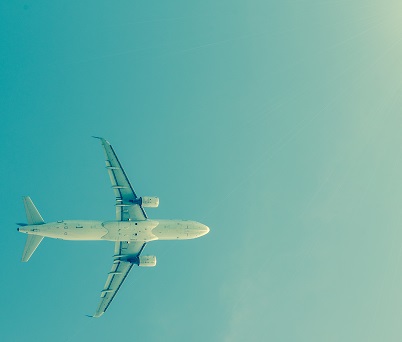 Plane in the sky view from below