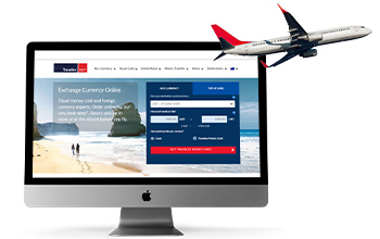 Desktop with Travelex website and a flying plane in the background