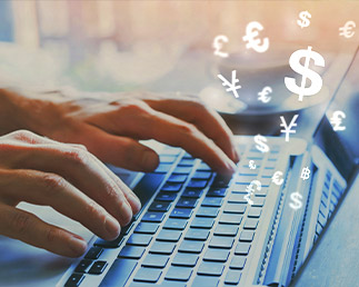 Currency Converter, fingers typing on laptop with currency symbols flying out of it
