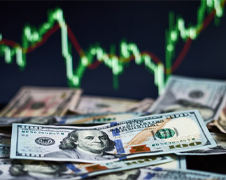 travel rate tracker, dollar notes in front of an electronic chart